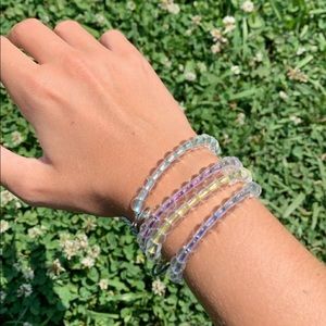 noahkade0629 4ocean bracelets in yellow and purple